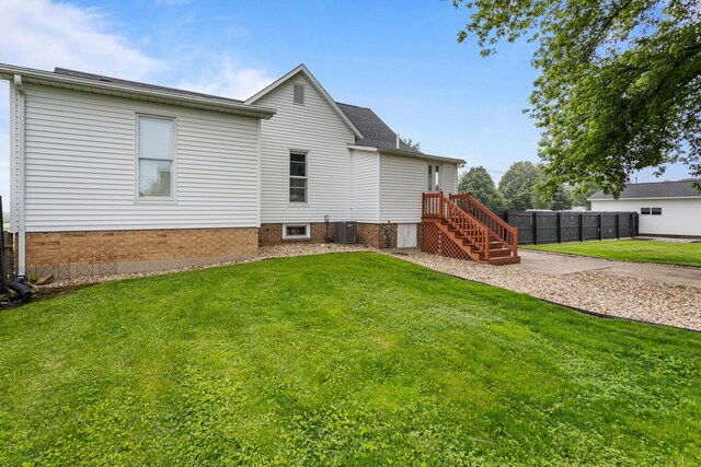207 N E Ave, Ogden, IL 61859 - back of house featuring central air condition unit and a shingled roof