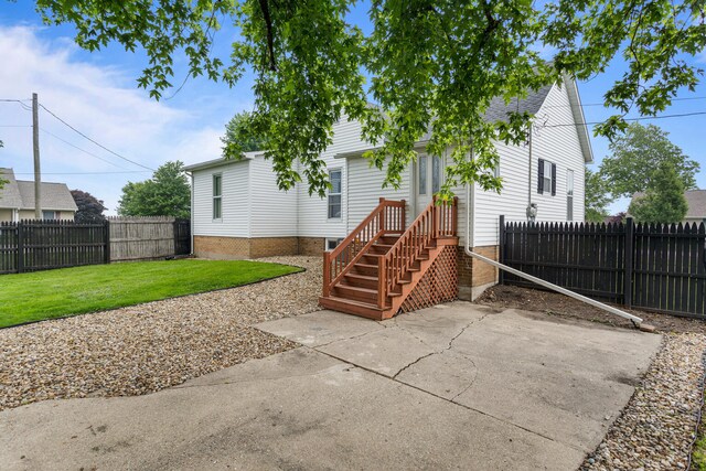207 N E Ave, Ogden, IL 61859 - rear view of property with a patio