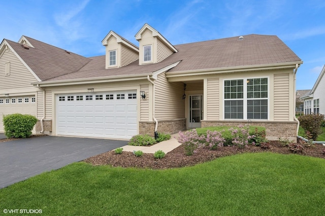 1736 Francis Dr, Pingree Grove, IL 60140 - view of front of house with an attached garage, brick siding, asphalt driveway, a front lawn, and a shingled roof