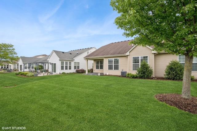 1736 Francis Dr, Pingree Grove, IL 60140 - back of house featuring a patio, a lawn, and central AC