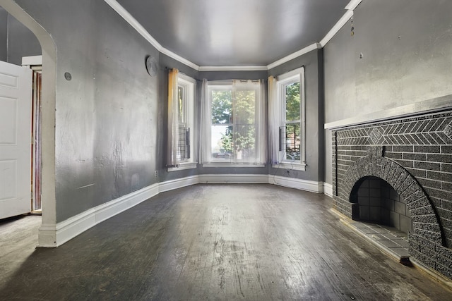 4321 W Maypole Ave, Chicago, IL 60624 - unfurnished living room featuring wood finished floors, ornamental molding, baseboards, arched walkways, and a fireplace