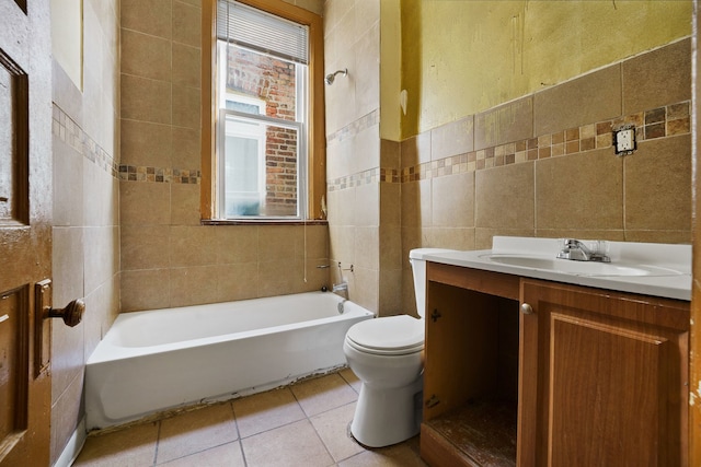 4321 W Maypole Ave, Chicago, IL 60624 - bathroom with tile walls, toilet, vanity, and tile patterned floors