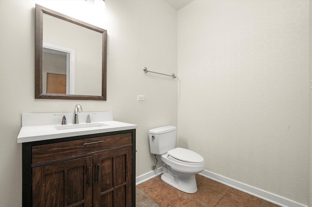 1935 S Archer Ave Unit 622, Chicago, IL 60616 - bathroom with baseboards, toilet, vanity, and tile patterned floors