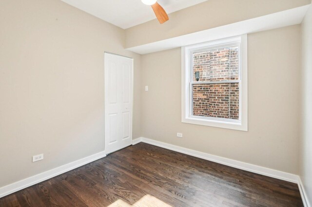 7801 S Honore St, Chicago, IL 60620 - spare room with dark wood finished floors, baseboards, and a ceiling fan