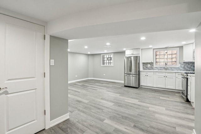 7801 S Honore St, Chicago, IL 60620 - kitchen with appliances with stainless steel finishes, decorative backsplash, light countertops, white cabinets, and recessed lighting