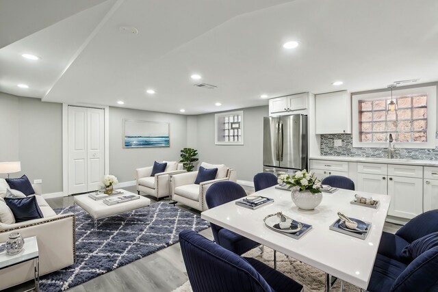 7801 S Honore St, Chicago, IL 60620 - living area featuring wood finished floors, baseboards, and recessed lighting