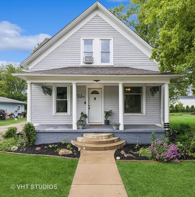 374 E Crystal Lake Ave, Crystal Lake, IL 60014 - view of front of home featuring covered porch and a front lawn
