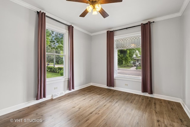 374 E Crystal Lake Ave, Crystal Lake, IL 60014 - spare room featuring wood finished floors, ornamental molding, baseboards, and a ceiling fan