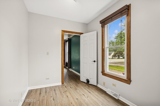 374 E Crystal Lake Ave, Crystal Lake, IL 60014 - spare room with light wood-style floors and baseboards