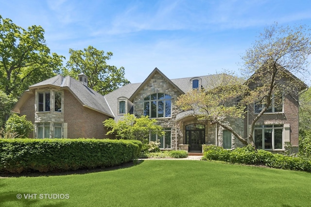 41W180 Highwood Ct, Elburn, IL 60119 - view of front of property with stone siding, a front yard, and a chimney