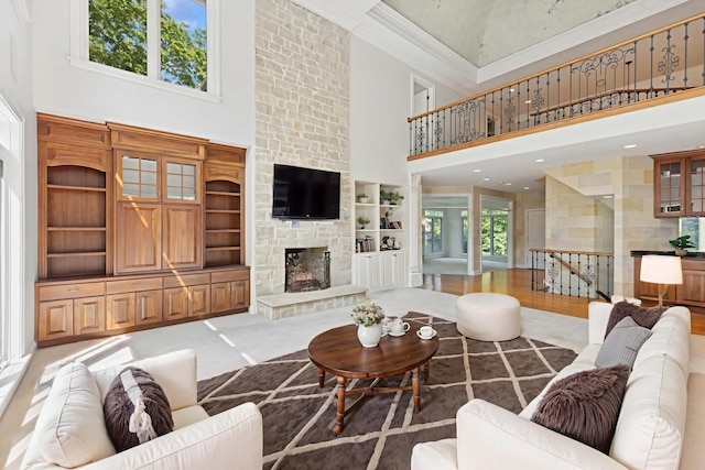 41W180 Highwood Ct, Elburn, IL 60119 - living area featuring a high ceiling, a large fireplace, crown molding, and built in features
