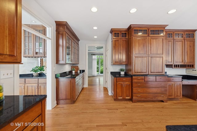 41W180 Highwood Ct, Elburn, IL 60119 - kitchen featuring light wood-type flooring, recessed lighting, brown cabinetry, and glass insert cabinets