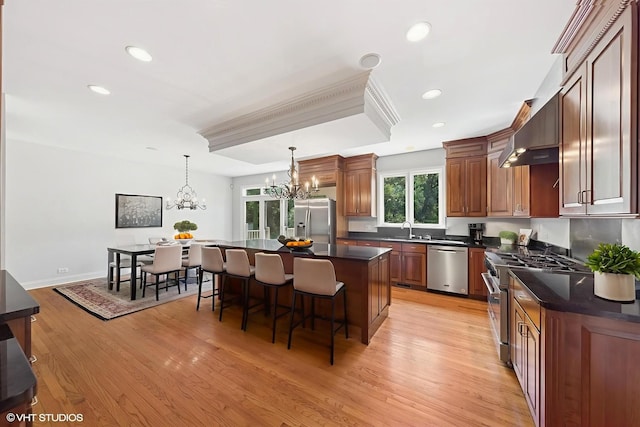 41W180 Highwood Ct, Elburn, IL 60119 - kitchen featuring stainless steel appliances, a chandelier, dark countertops, a breakfast bar, and recessed lighting