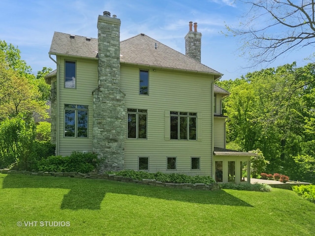 41W180 Highwood Ct, Elburn, IL 60119 - rear view of property featuring a lawn and a chimney