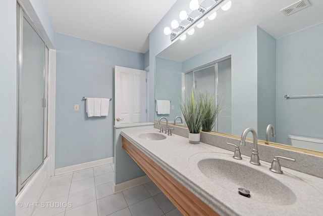 41W180 Highwood Ct, Elburn, IL 60119 - bathroom with tile patterned floors, double vanity, and enclosed tub / shower combo