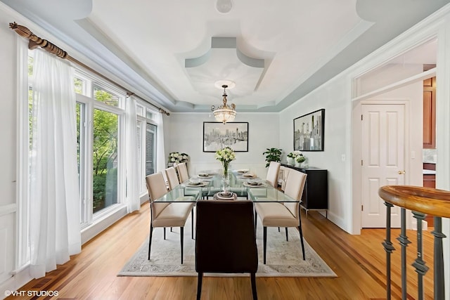 41W180 Highwood Ct, Elburn, IL 60119 - dining room featuring a raised ceiling, a chandelier, light wood finished floors, and crown molding