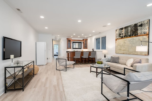 2128 N Winchester Ave, Chicago, IL 60614 - living room with light wood finished floors, recessed lighting, and baseboards