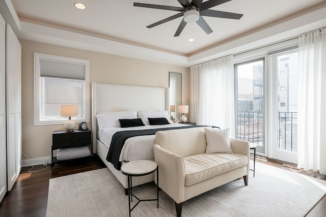 2128 N Winchester Ave, Chicago, IL 60614 - bedroom featuring a raised ceiling, baseboards, recessed lighting, dark wood finished floors, and access to exterior