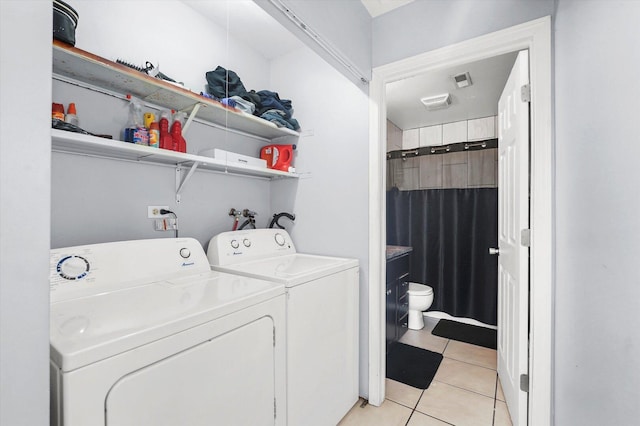 1026 Bothwell Ct, Bolingbrook, IL 60440 - laundry area with separate washer and dryer and light tile patterned flooring