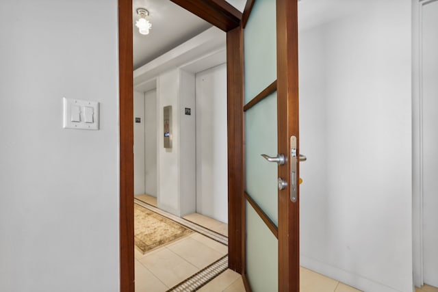 3200 N Lake Shore Dr Unit 2905, Chicago, IL 60657 - hallway featuring elevator and light tile patterned floors