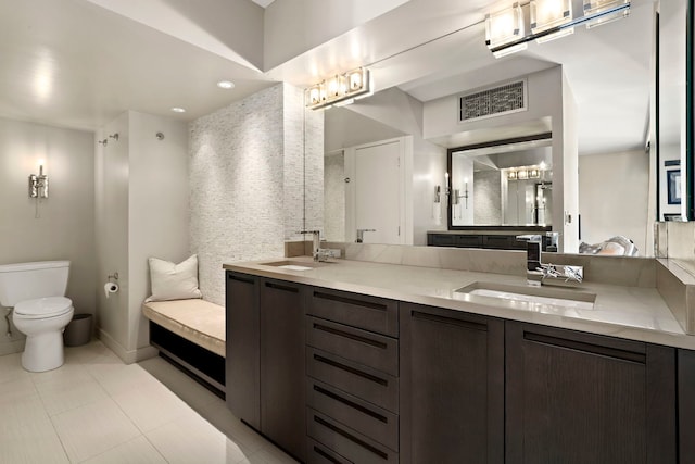 3200 N Lake Shore Dr Unit 2905, Chicago, IL 60657 - full bathroom with double vanity, toilet, and baseboards