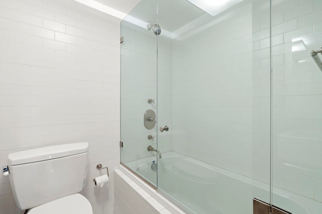 3200 N Lake Shore Dr Unit 2905, Chicago, IL 60657 - full bathroom featuring tiled shower / bath combo, toilet, and tile walls