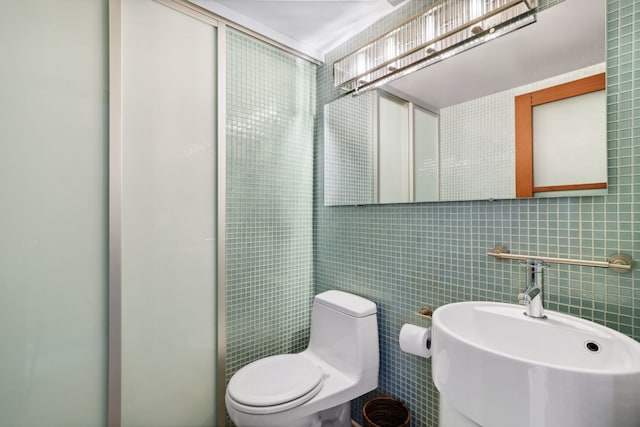 3200 N Lake Shore Dr Unit 2905, Chicago, IL 60657 - bathroom with a sink, tile walls, toilet, a shower, and tasteful backsplash