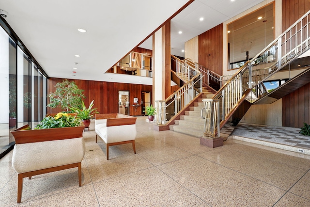 3200 N Lake Shore Dr Unit 2905, Chicago, IL 60657 - lobby with wooden walls, stairs, recessed lighting, and a towering ceiling