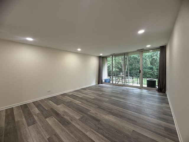 5800 Oakwood Dr Unit 2J, Lisle, IL 60532 - unfurnished room featuring recessed lighting, dark wood-type flooring, and a wall of windows