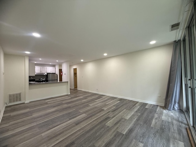 5800 Oakwood Dr Unit 2J, Lisle, IL 60532 - unfurnished living room with recessed lighting and dark wood-style floors