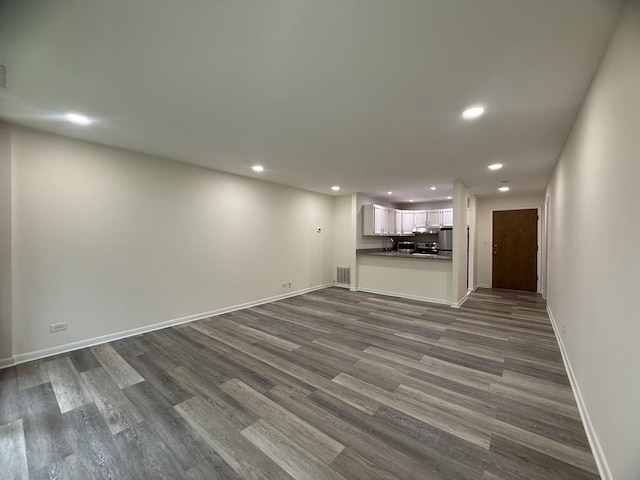 5800 Oakwood Dr Unit 2J, Lisle, IL 60532 - unfurnished living room with recessed lighting and dark wood-type flooring