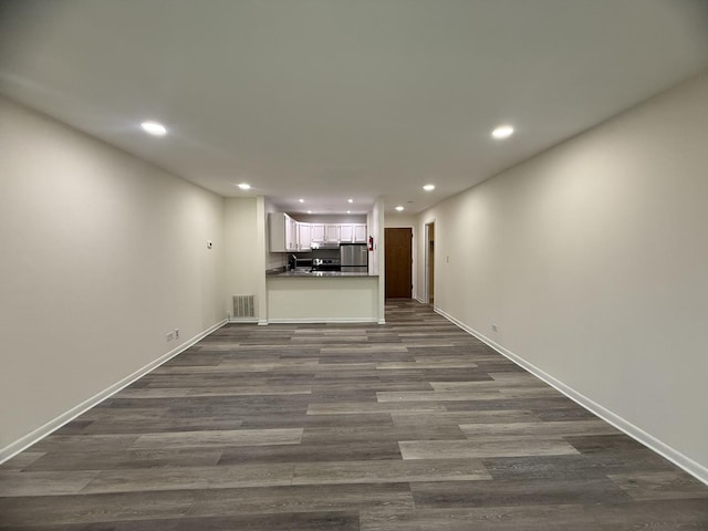 5800 Oakwood Dr Unit 2J, Lisle, IL 60532 - unfurnished living room featuring recessed lighting and dark wood-type flooring