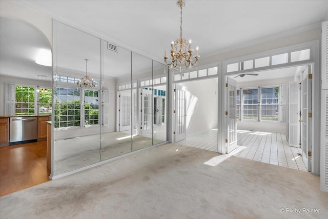324 Torrington Dr, Bloomingdale, IL 60108 - interior space with a chandelier, carpet floors, ornamental molding, and arched walkways