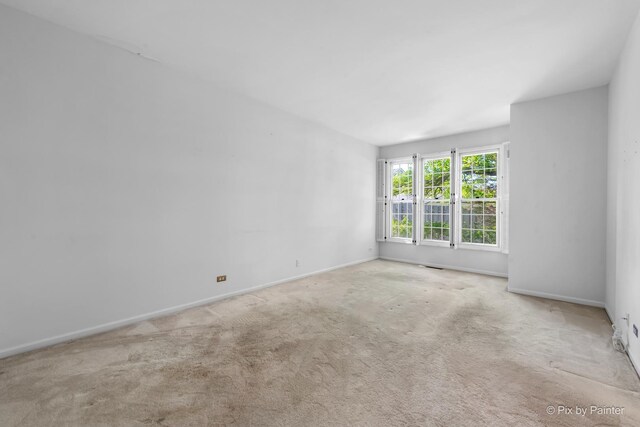 324 Torrington Dr, Bloomingdale, IL 60108 - empty room with carpet flooring and baseboards