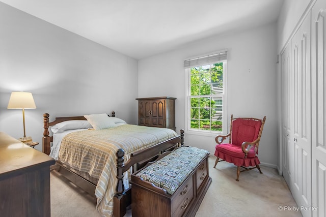 324 Torrington Dr, Bloomingdale, IL 60108 - bedroom with light colored carpet, a closet, and baseboards