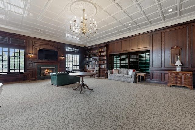 324 Torrington Dr, Bloomingdale, IL 60108 - office featuring a fireplace, a chandelier, carpet floors, ornamental molding, and a decorative wall