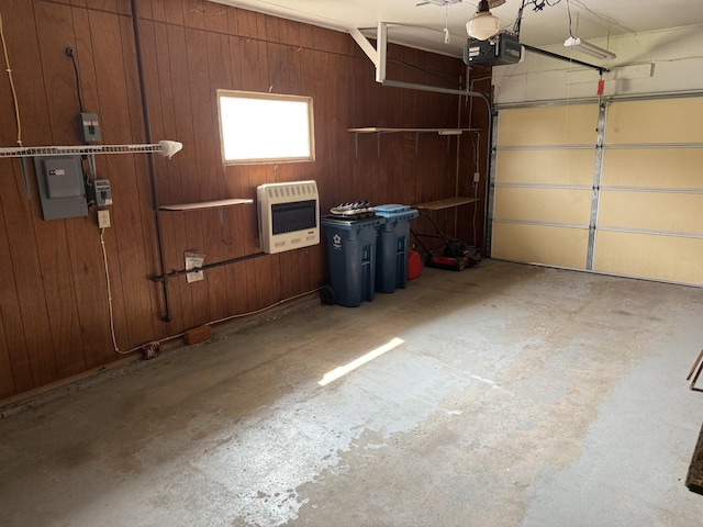 318 Durant St, Oglesby, IL 61348 - garage with heating unit, a garage door opener, and wooden walls
