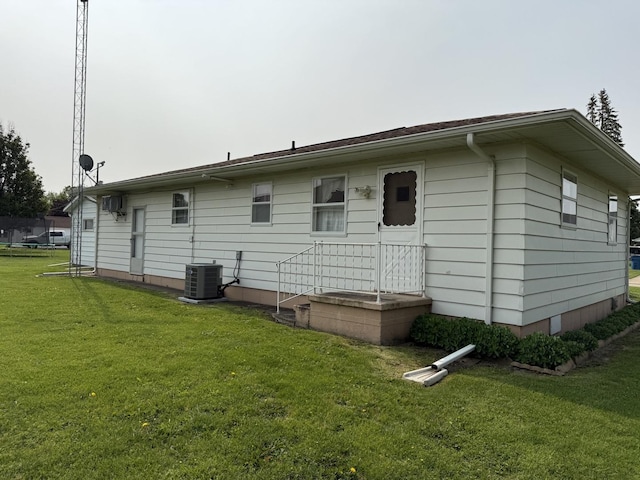 318 Durant St, Oglesby, IL 61348 - rear view of property with a yard and central AC