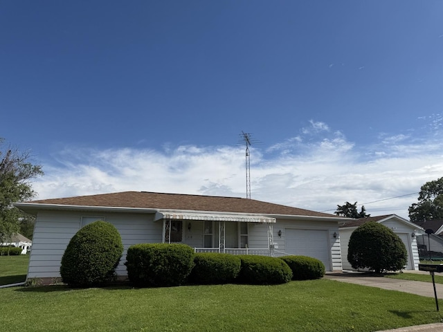 318 Durant St, Oglesby, IL 61348 - ranch-style house with a garage, a front yard, and concrete driveway