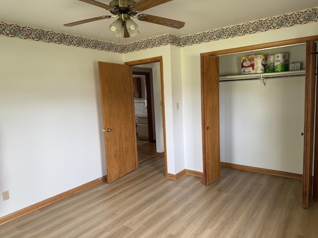 318 Durant St, Oglesby, IL 61348 - unfurnished bedroom featuring light wood finished floors, baseboards, a closet, and a ceiling fan
