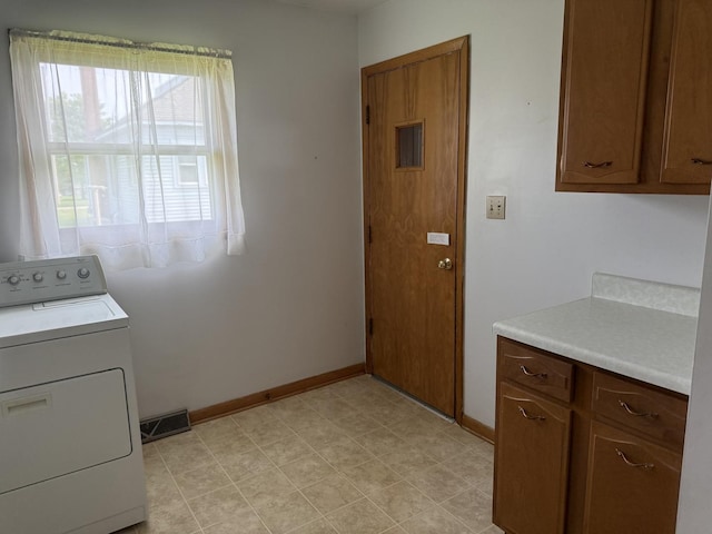 318 Durant St, Oglesby, IL 61348 - laundry room with washer / clothes dryer, baseboards, and light flooring