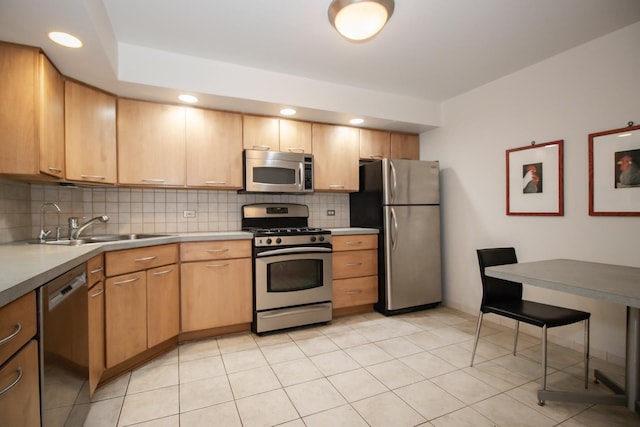 235 Marengo Ave Unit 3B, Forest Park, IL 60130 - kitchen featuring stainless steel appliances, decorative backsplash, a sink, light countertops, and recessed lighting
