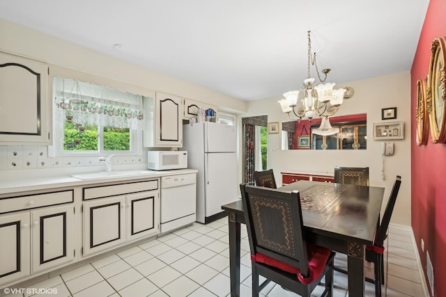 9047 Crawford Ave, Skokie, IL 60076 - dining room featuring a chandelier and light tile patterned flooring