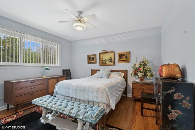 9047 Crawford Ave, Skokie, IL 60076 - bedroom with wood finished floors, ceiling fan, and baseboards