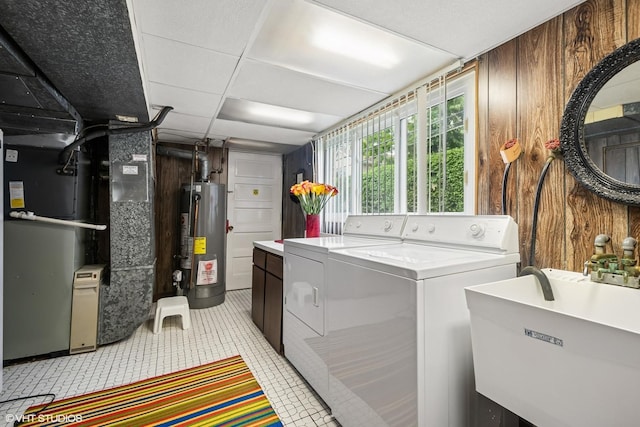 9047 Crawford Ave, Skokie, IL 60076 - laundry area with gas water heater, washing machine and dryer, heating unit, wood walls, and light tile patterned floors