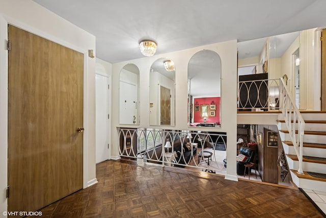9047 Crawford Ave, Skokie, IL 60076 - entryway with stairway, baseboards, and arched walkways