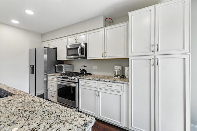 2S404 Emerald Green Dr Unit 44-H, Warrenville, IL 60555 - kitchen with stainless steel appliances, recessed lighting, white cabinets, light stone counters, and dark wood-style floors