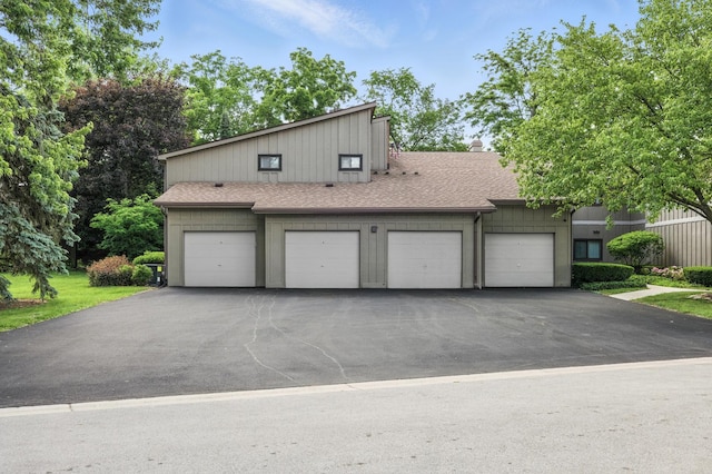 2S404 Emerald Green Dr Unit 44-H, Warrenville, IL 60555 - view of front of house with asphalt driveway, a shingled roof, a chimney, and an attached garage