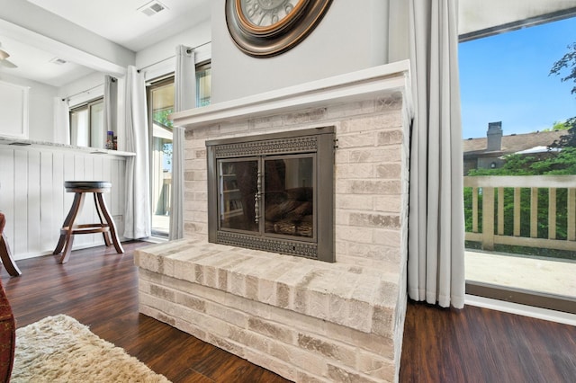 2S404 Emerald Green Dr Unit 44-H, Warrenville, IL 60555 - unfurnished living room featuring wood finished floors and a fireplace