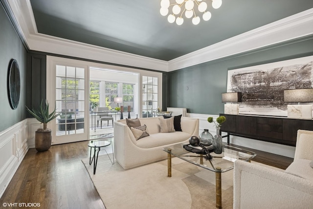 3120 N Sheridan Rd Unit A1, Chicago, IL 60657 - living room with ornamental molding, a decorative wall, wood finished floors, a chandelier, and a wainscoted wall